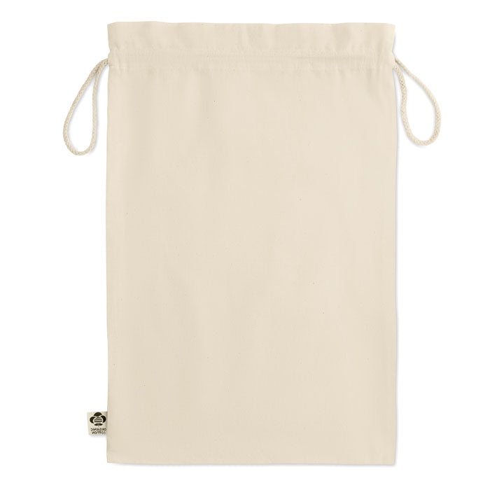 Bolsa de regalo grande de algodón orgánico en color crema, con cierre de cordón, fondo plano.