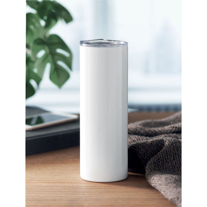 Vaso de acero inoxidable blanco sobre mesa de madera