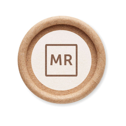 Bote de cartón tumbado con discos de champú