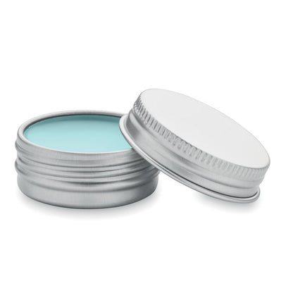 Protector labial azul en caja de lata plateada