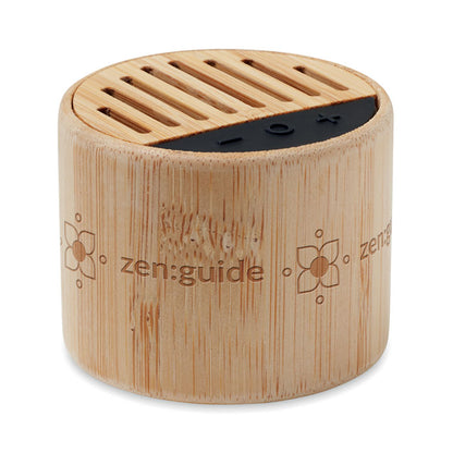 Altavoz inalámbrico circular con carcasa de madera y plástico negro personalizado a láser alrededor del altavoz