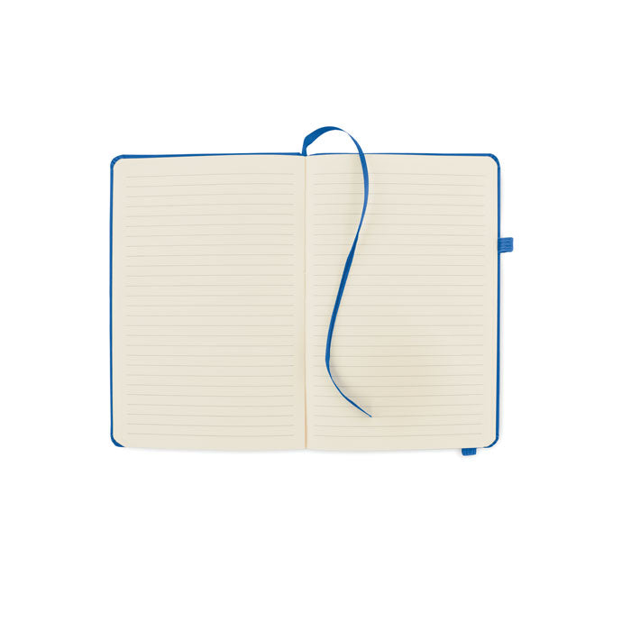 Interior de libreta rayada A5 con hojas en blanco y marcador de cinta azul, ideal para tomar notas y organizar ideas.