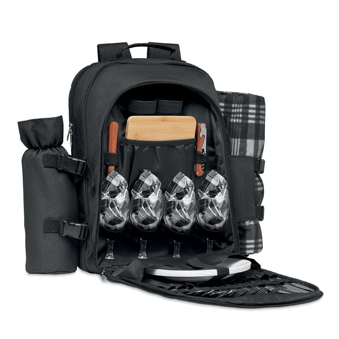 Interior de mochila picnic para 4 personas, color negro, con copas, utensilios, manta y tabla de cortar.