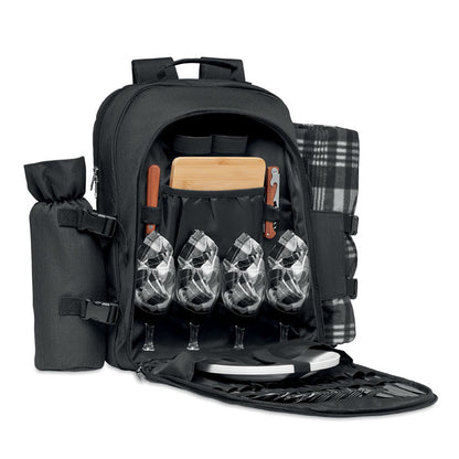 Mochila negra de picnic con copas, servilletas, cubiertos y platos para 4 personas en el interior y con manta y portabotellas en los laterales exteriores