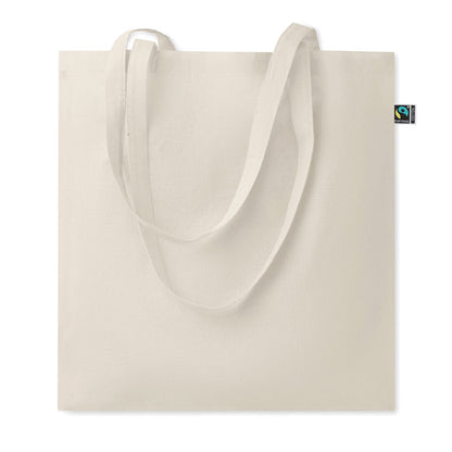 Bolsa de algodón color natural con asas largas y con etiqueta Fairtrade cosida en el laterial