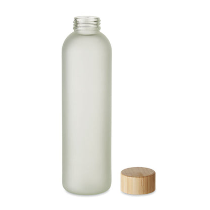 Botella vidrio esmerilado con tapa de madera al lado