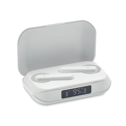 Auriculares blancos en caja de carga