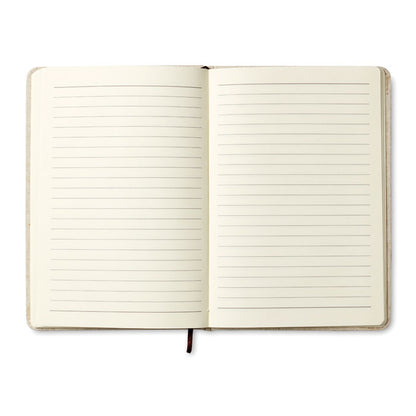 Libreta abierta con vista páginas crema rayadas