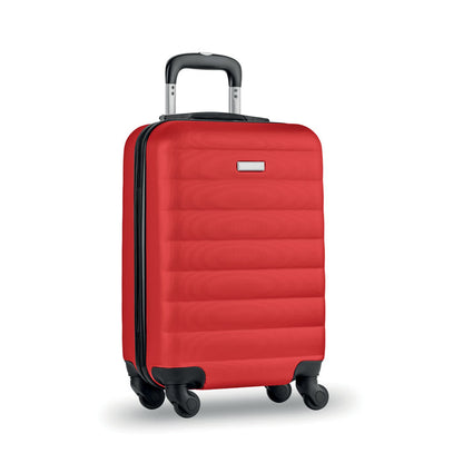 Trolley rígido de viaje color rojo con 4 ruedas y con pequeña chapa metálica para personalizar