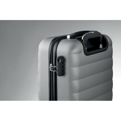 Detalle del cierre de seguridad del trolley de viaje rígido gris