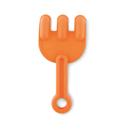 Rastrillo naranja para jugar en la playa