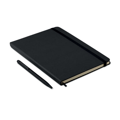 Visa lateral de libreta y boli negro