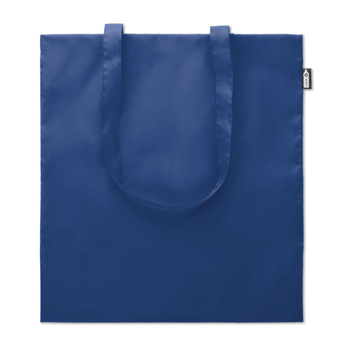 Bolsa de compra de RPET en color azul, con asas largas y acabado suave, diseño ecológico.