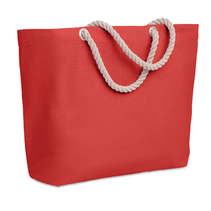 Bolsa roja de playa con asas beige de cordón vista de lado