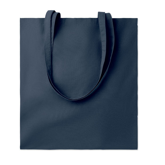 Bolsa de algodón de color azul marino con asas largas, diseño simple y resistente, perspectiva frontal.