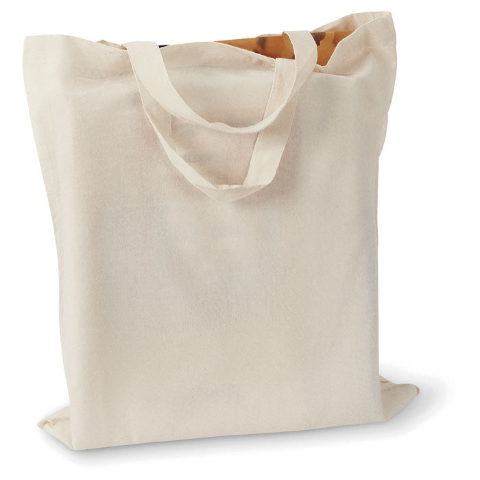 Bolsa de algodón MARKETA + 140 gr/m² con asas cortas, diseño plegable y resistente para uso en jardinería o como bolsa de playa.