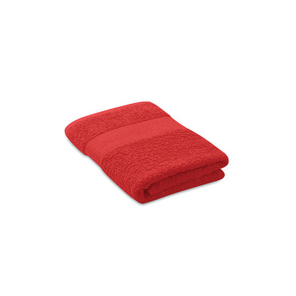 Toalla de rizo de algodón  roja con cenefa doblada