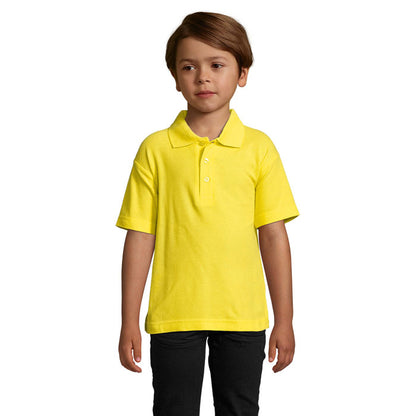 Polo negro infantil con tapeta de botones, imagen frontal